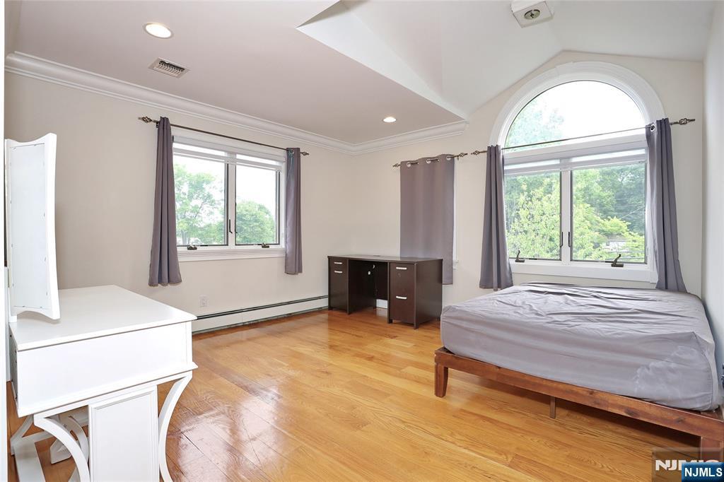 65 Ross Avenue Demarest, NJ 07627 - Photo 34 of 48 a bedroom with a bed and a window