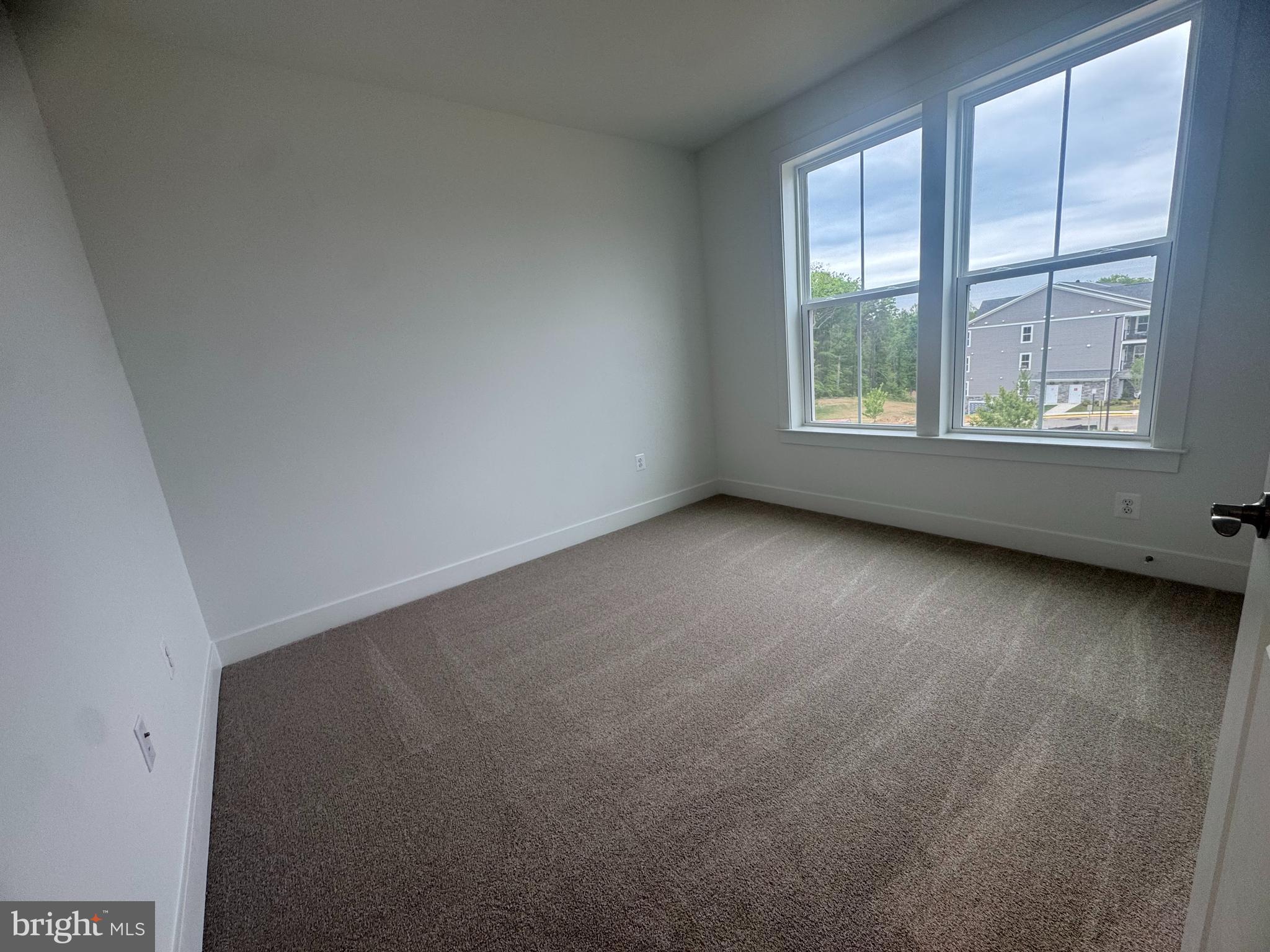 82 Valerian Loop, Unit 2 Stafford, VA 22554 - Photo 14 of 55 an empty room with windows
