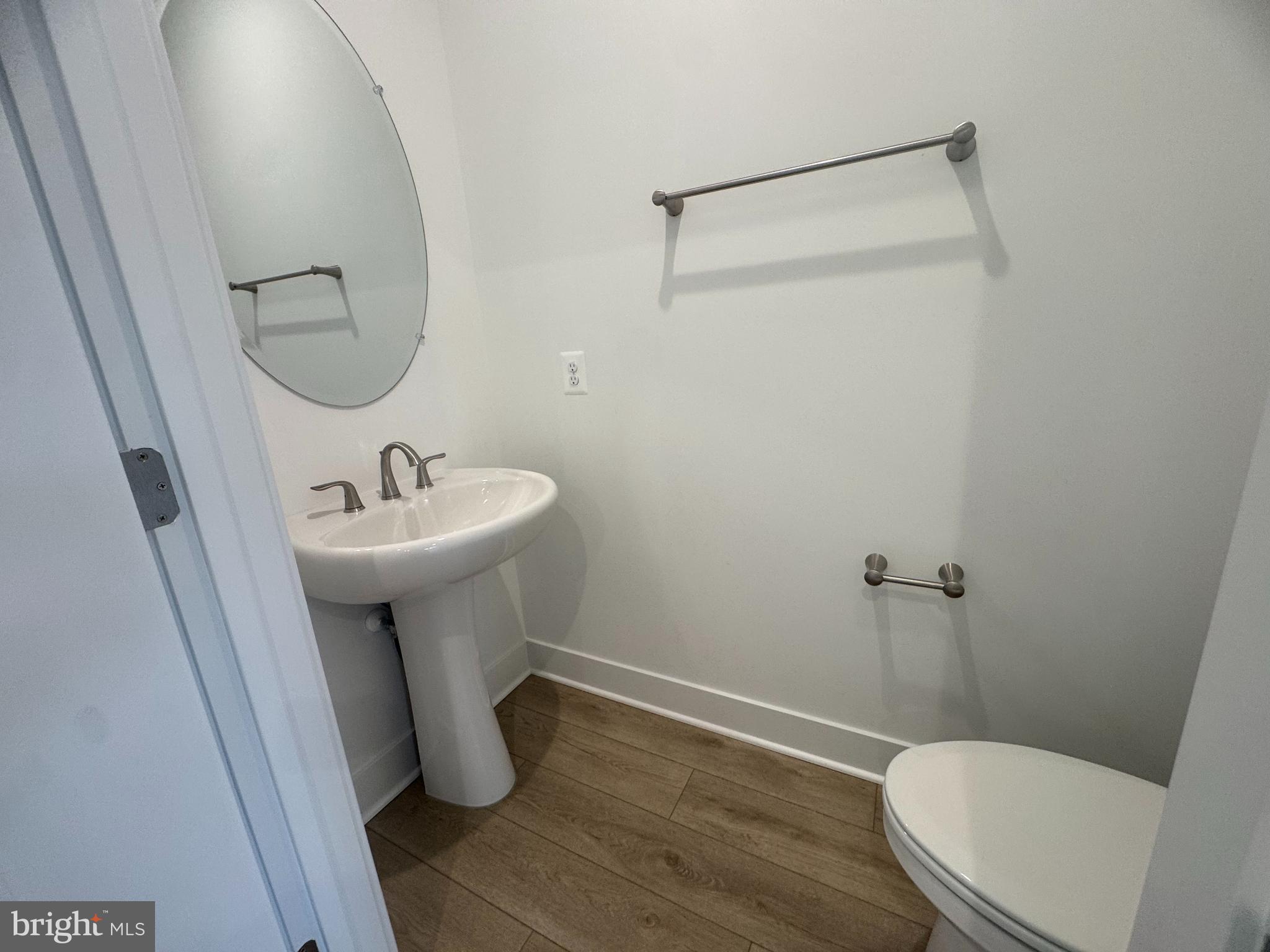 82 Valerian Loop, Unit 2 Stafford, VA 22554 - Photo 17 of 55 a bathroom with a sink toilet and a mirror
