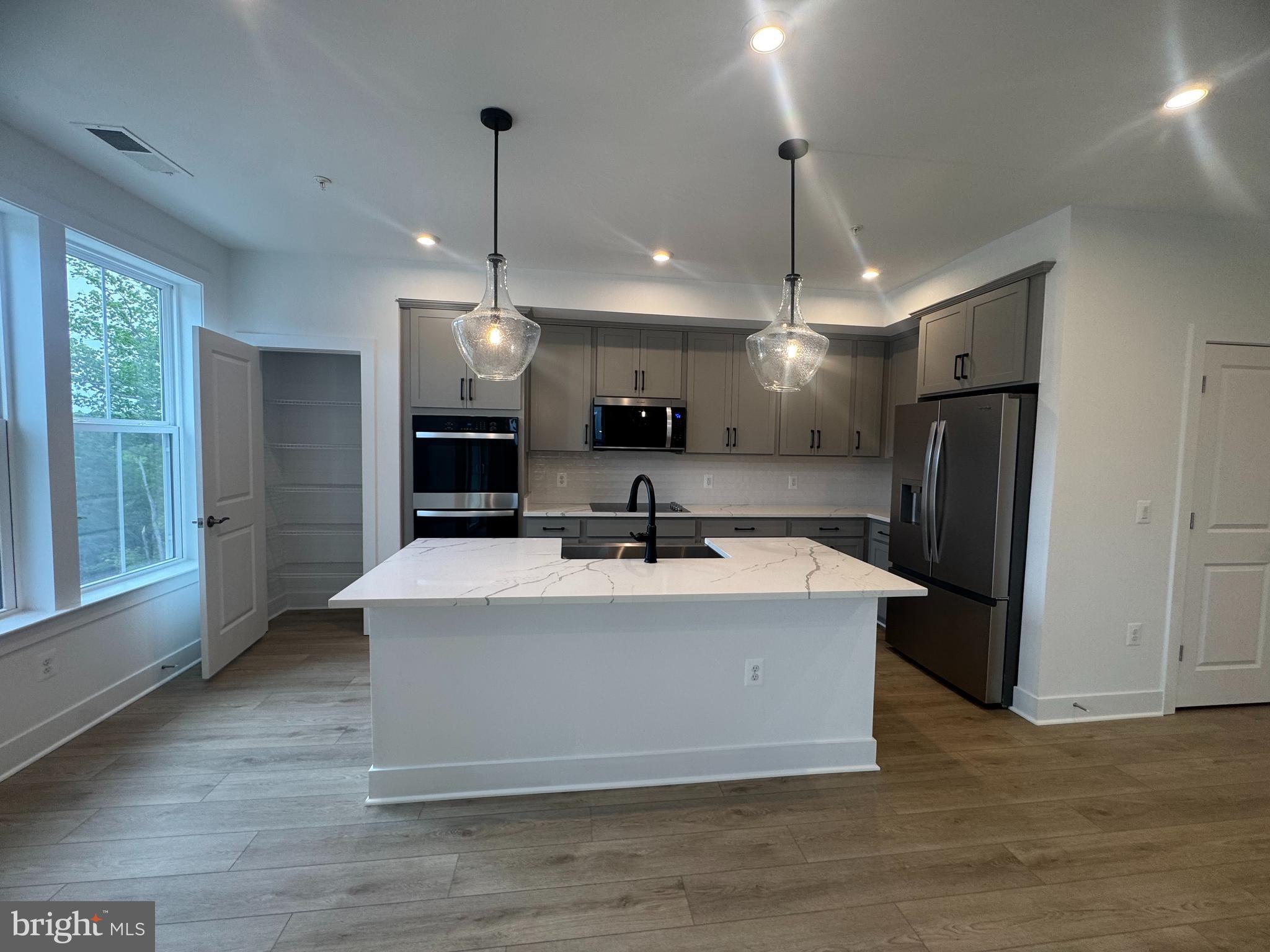 82 Valerian Loop, Unit 2 Stafford, VA 22554 - Photo 3 of 55 a view of a kitchen with stainless steel appliances granite countertop a sink a refrigerator and a stove