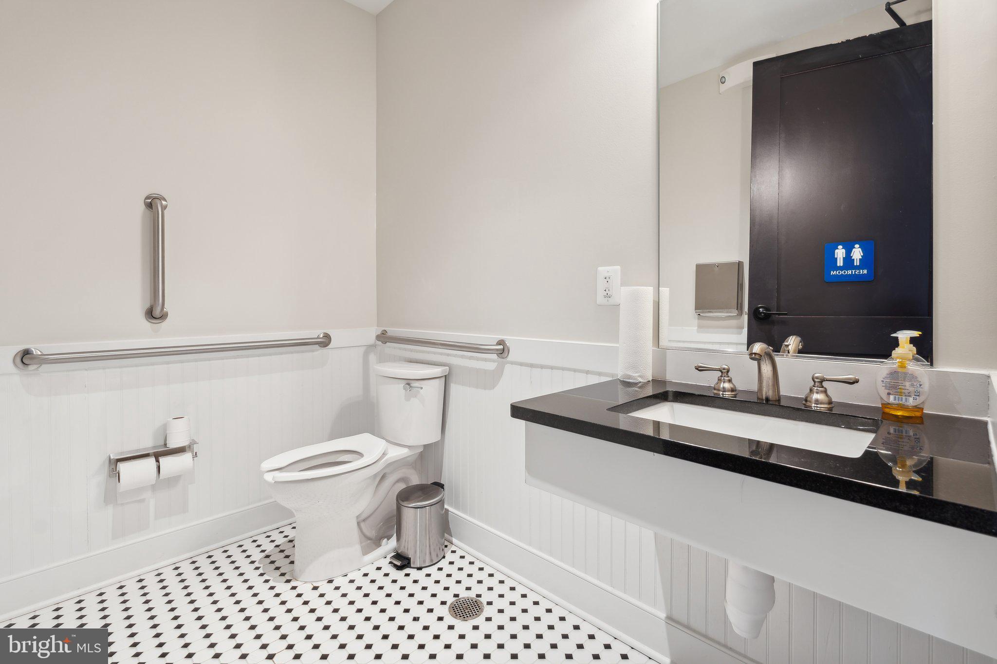 82 Valerian Loop, Unit 2 Stafford, VA 22554 - Photo 43 of 55 a bathroom with a sink a toilet a mirror and shower