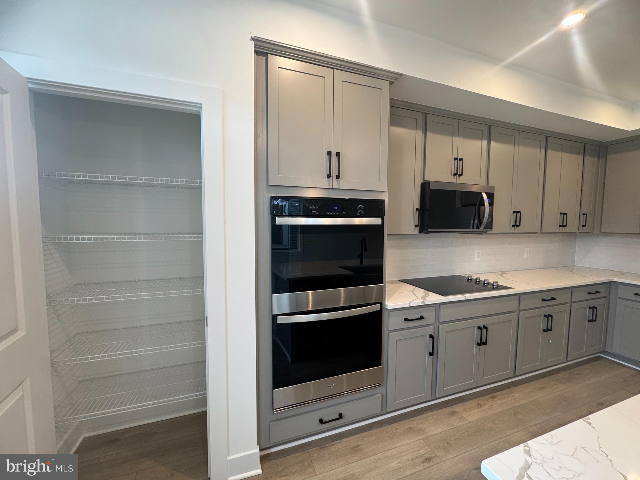 82 Valerian Loop, Unit 2 Stafford, VA 22554 - Photo 5 of 55 a kitchen with granite countertop cabinets and steel stainless steel appliances