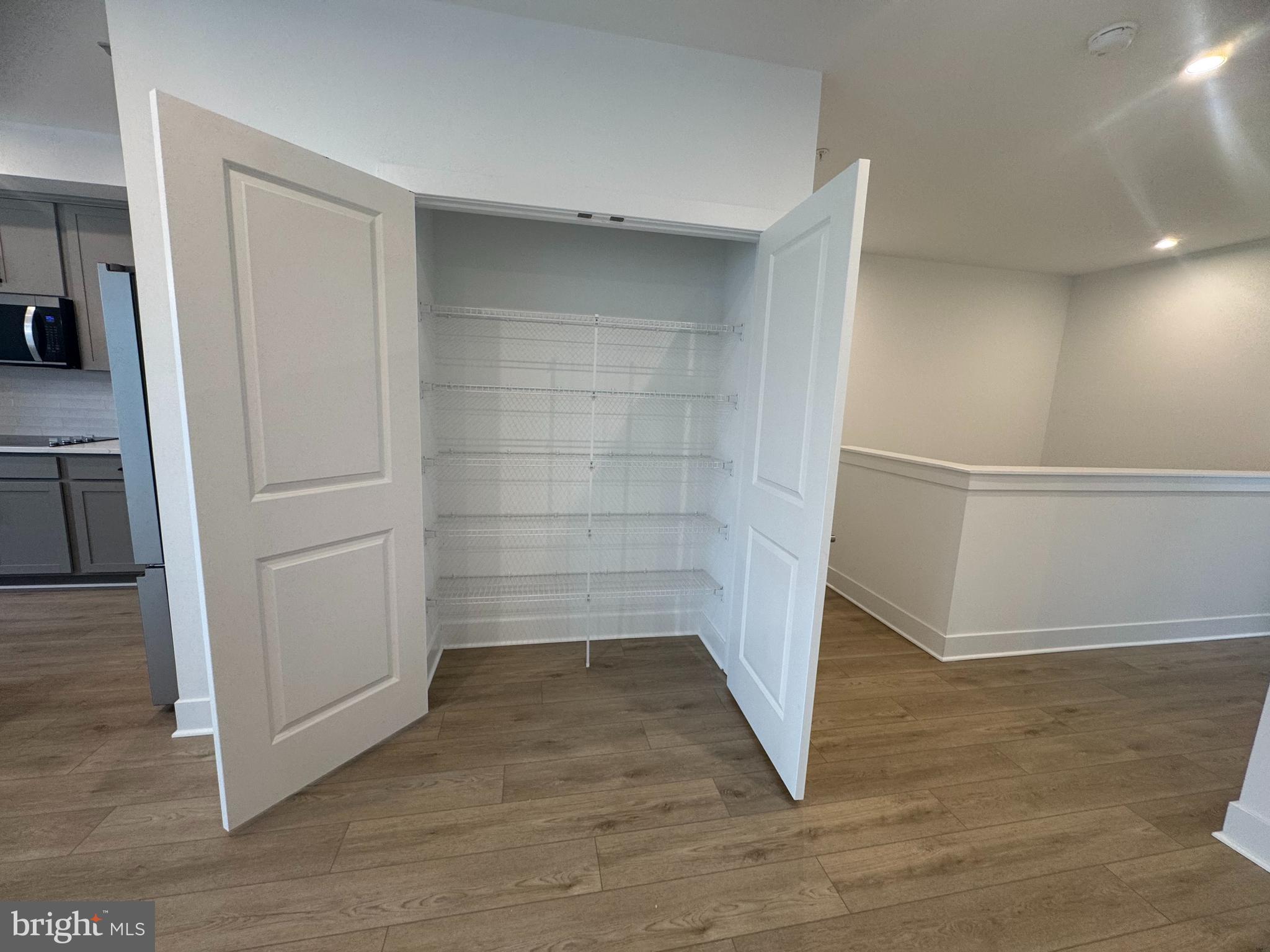 82 Valerian Loop, Unit 2 Stafford, VA 22554 - Photo 8 of 55 a view of walk in closet with empty racks