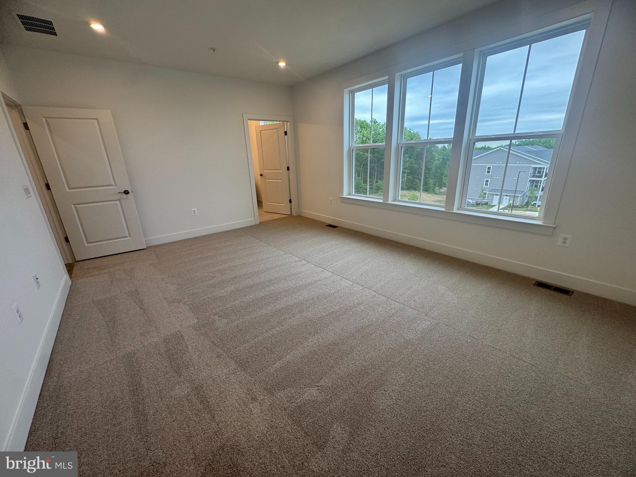 82 Valerian Loop, Unit 2 Stafford, VA 22554 - Photo 9 of 55 a view of an empty room with a window