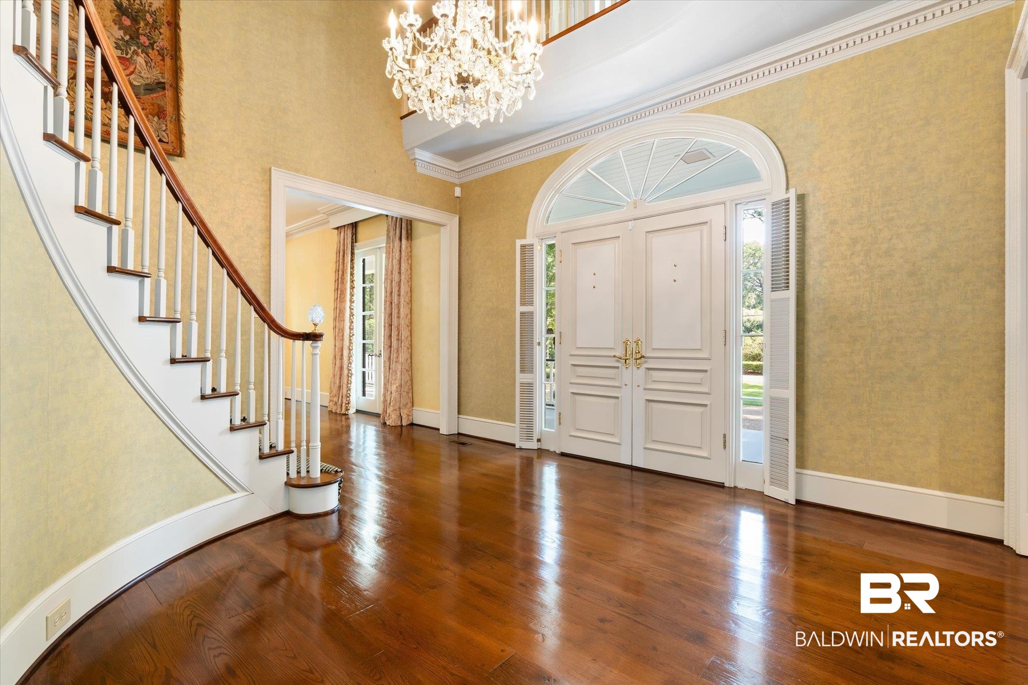 54 Turnin Lane Mobile, AL 36608 - Photo 3 of 35 Entryway featuring a high ceiling, dark hardwood / wood-style floors, ornamental molding, and a healthy amount of sunlight