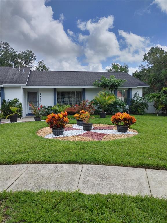 7607 Benji Ridge Trail Kissimmee, FL 34747 - Photo 2 of 58 a front view of house with yard and green space