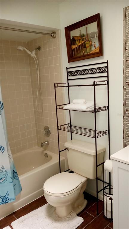 7607 Benji Ridge Trail Kissimmee, FL 34747 - Photo 25 of 58 a bathroom with a toilet a sink and bathtub