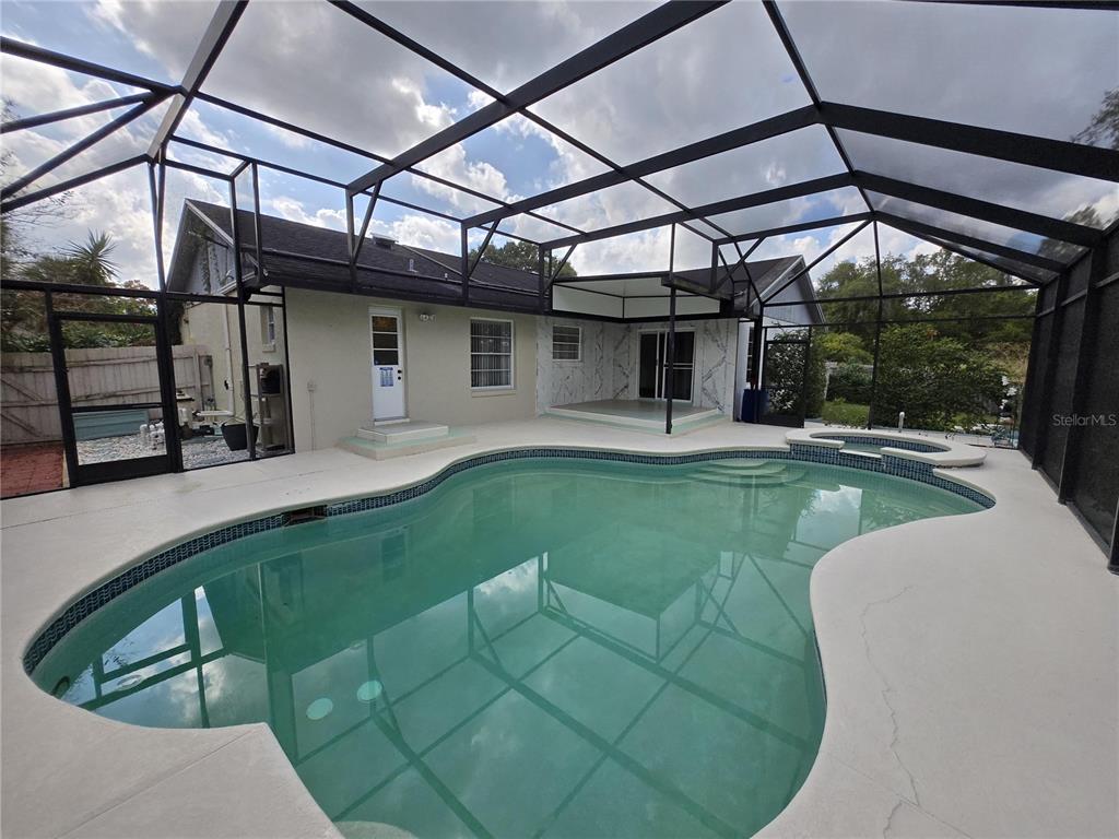 7607 Benji Ridge Trail Kissimmee, FL 34747 - Photo 3 of 58 a view of a swimming pool with a patio