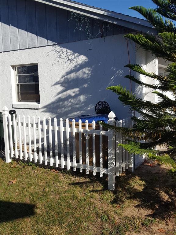 7607 Benji Ridge Trail Kissimmee, FL 34747 - Photo 38 of 58 a view of a chairs and table in backyard