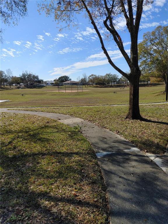 7607 Benji Ridge Trail Kissimmee, FL 34747 - Photo 58 of 58 a view of a lake with houses in the back
