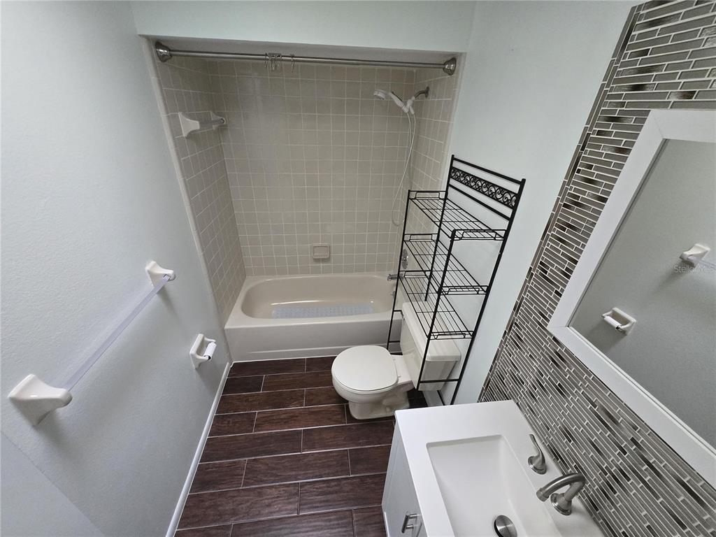 7607 Benji Ridge Trail Kissimmee, FL 34747 - Photo 9 of 58 a bathroom with a sink and toilet