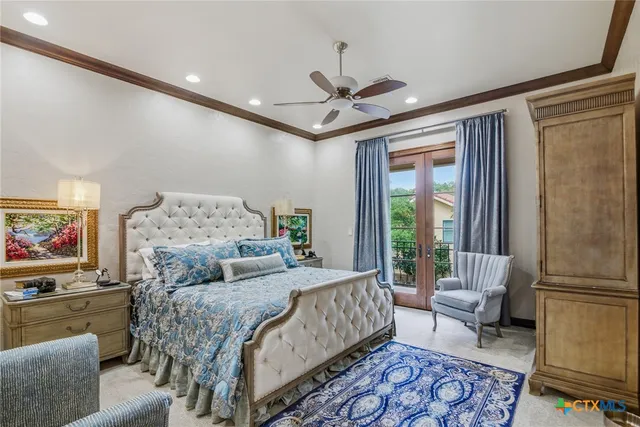 a bedroom with a large bed couch and a window