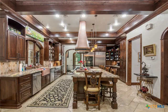 a outdoor dining area with chairs and tables