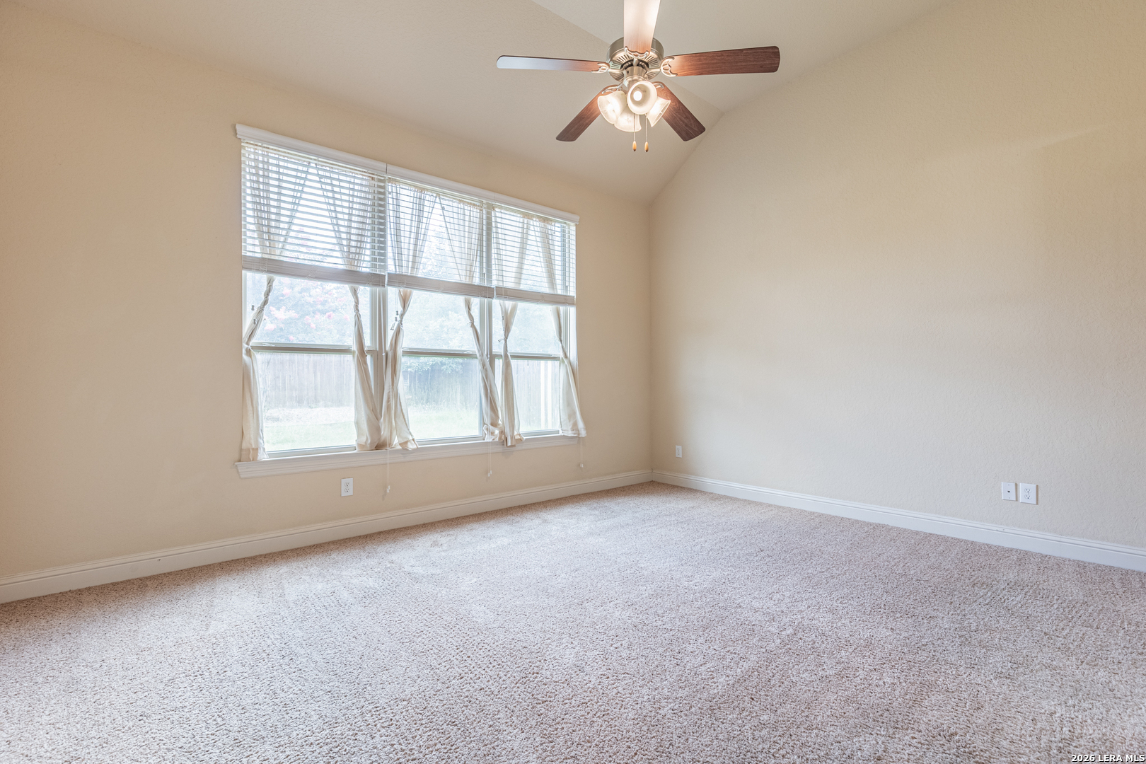 8103 Mystic Chase Boerne, TX 78015 - Photo 21 of 49 an empty room with chandelier fan and windows