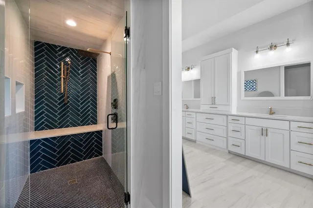 a view of walk in closet and bathroom