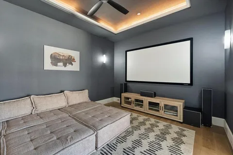 a bedroom with bed and a flat screen tv