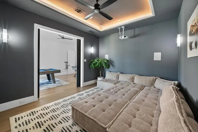 a bedroom with a bed and a table with potted plant