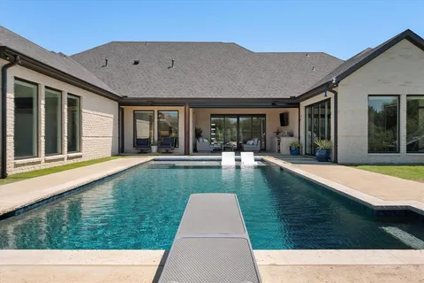 a view of swimming pool with a lounge chair
