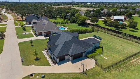 an aerial view of a house with a garden