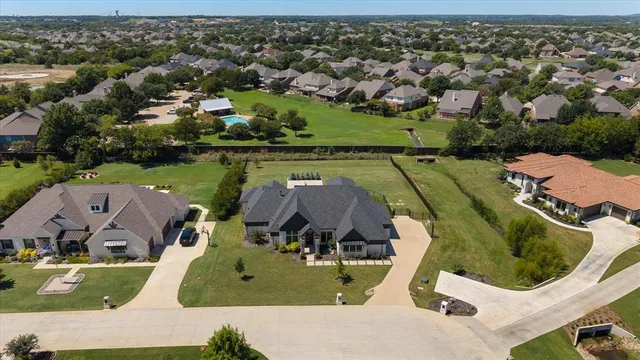 an aerial view of a house with outdoor space