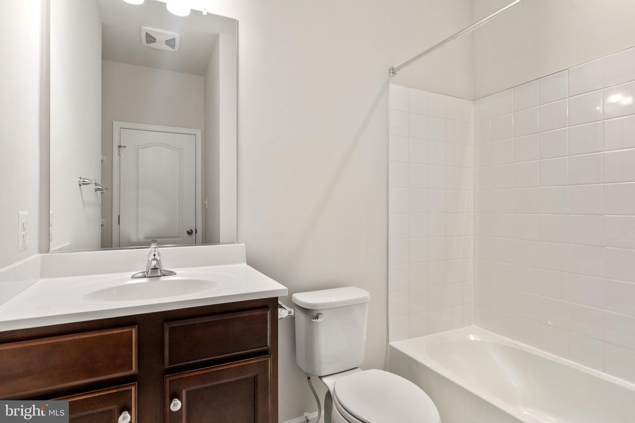 1805 Evans Road Frederick, MD 21702 - Photo 15 of 21 a bathroom with a sink toilet and shower