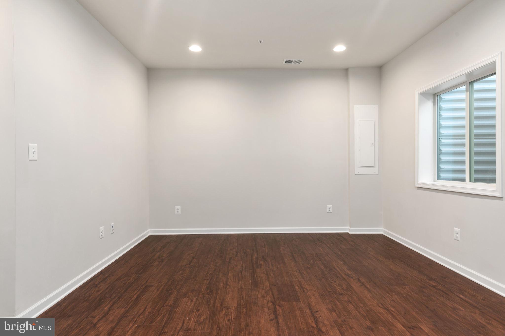 1805 Evans Road Frederick, MD 21702 - Photo 18 of 21 wooden floor in an empty room with a window