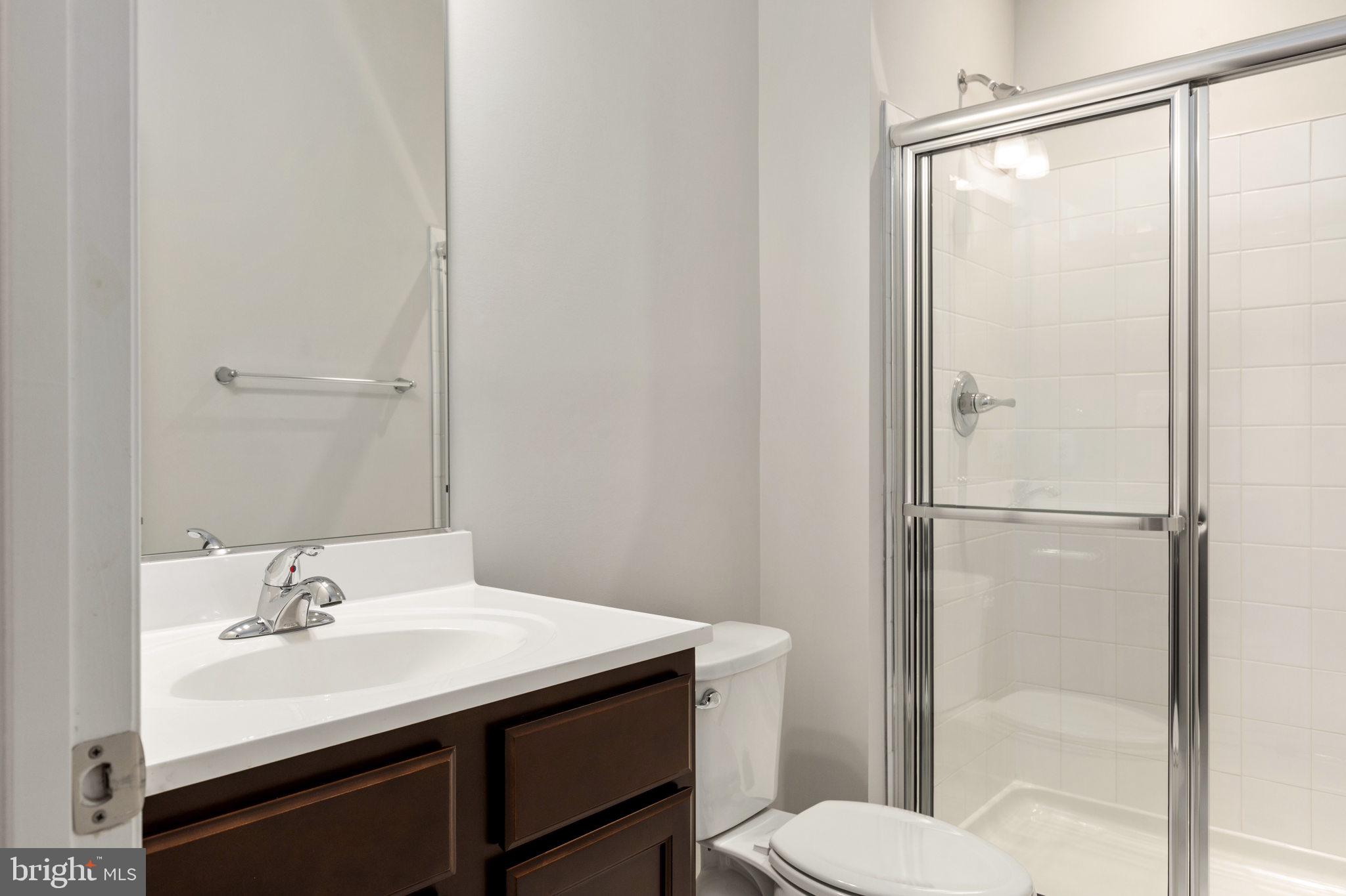 1805 Evans Road Frederick, MD 21702 - Photo 19 of 21 a bathroom with a sink toilet and shower