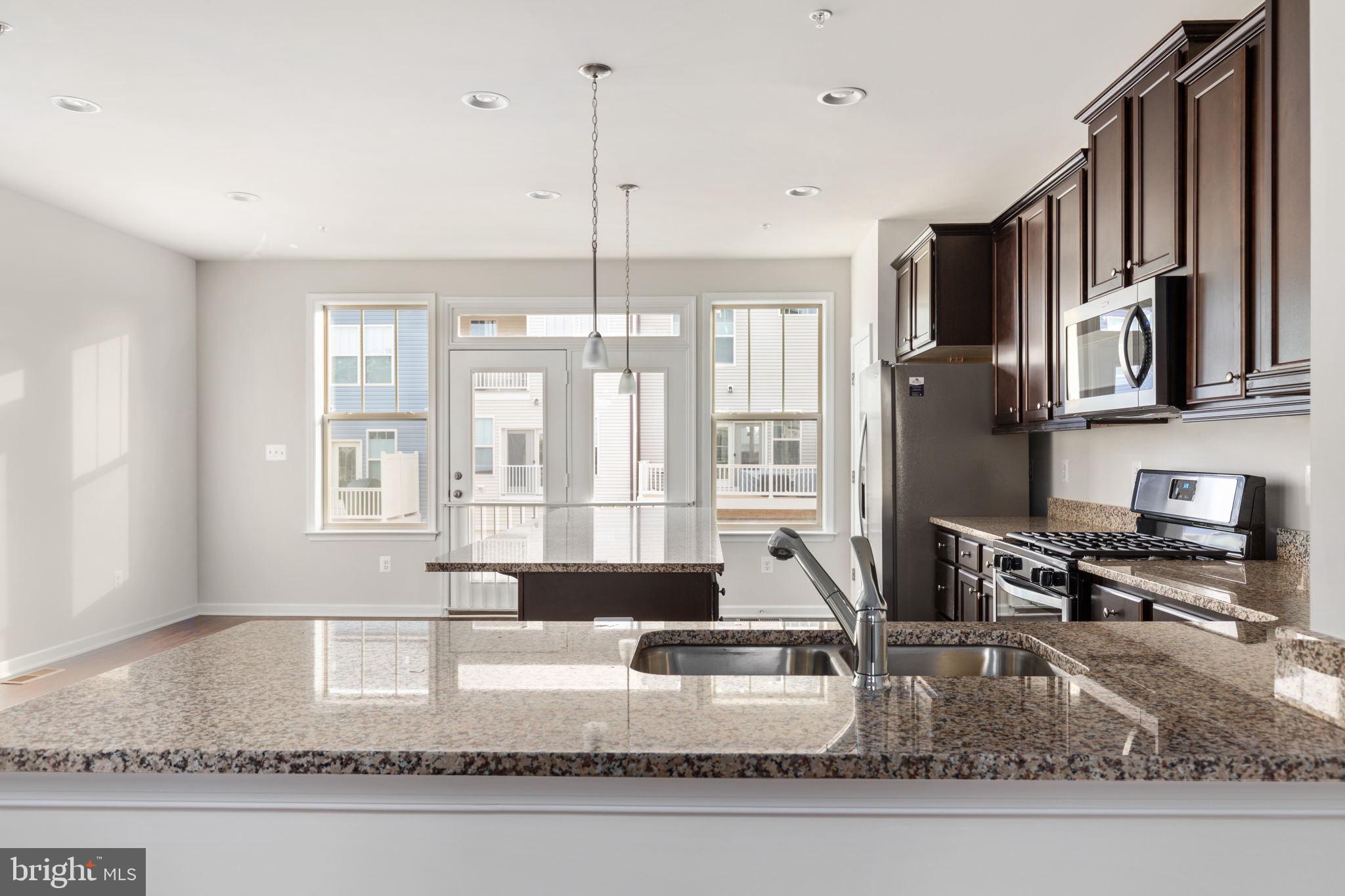 1805 Evans Road Frederick, MD 21702 - Photo 3 of 21 a kitchen with a large window appliances and cabinets