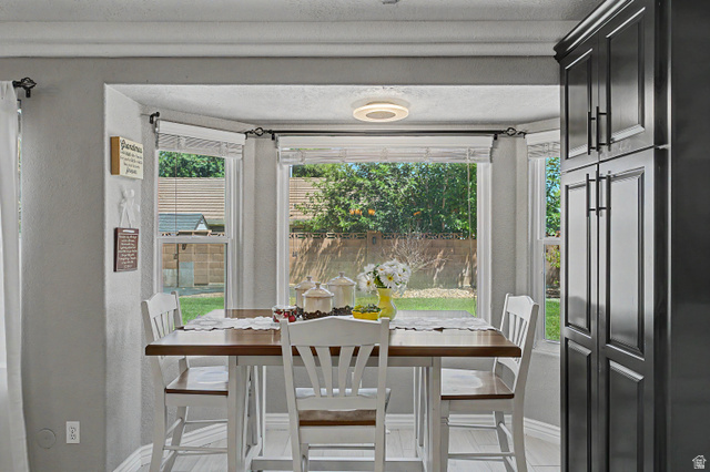 3034 Swiss Drive Santa Clara, UT 84765 - Photo 20 of 59 Bay window dining area with natural light and a backyard perspective