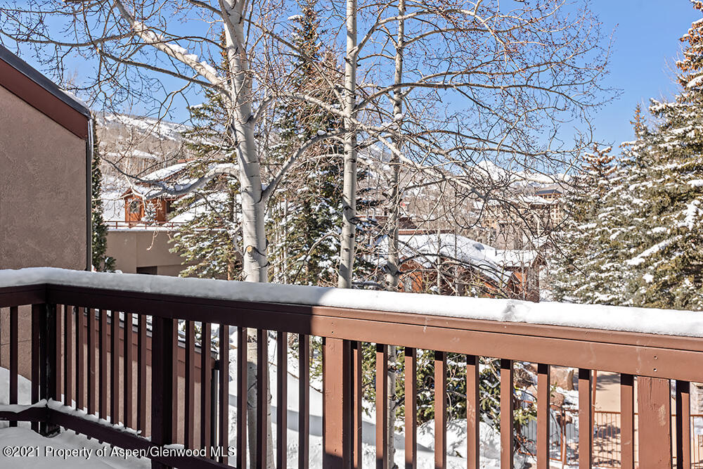 800 Ridge Road, Unit 12 Snowmass Village, CO 81615 - Photo 15 of 27 a view of a wooden fence
