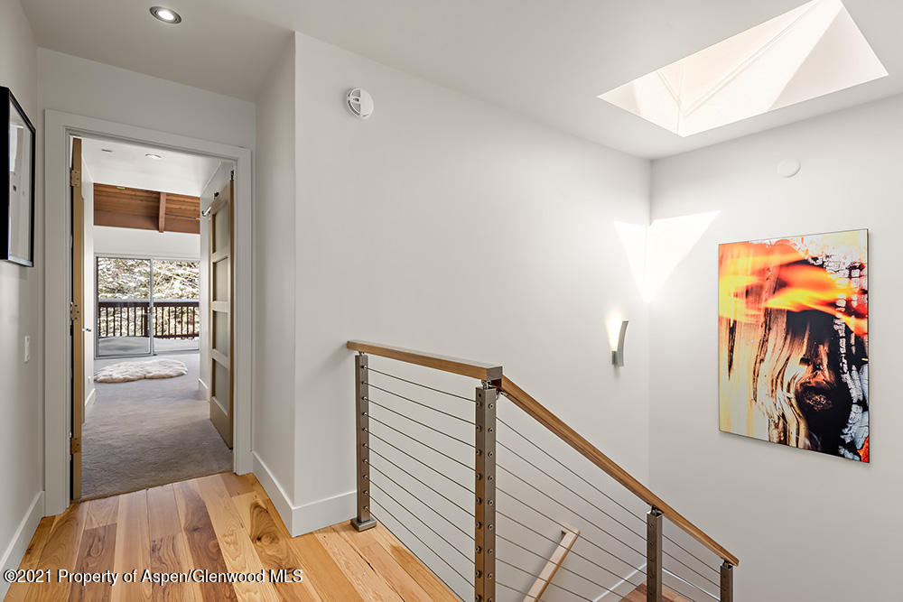 800 Ridge Road, Unit 12 Snowmass Village, CO 81615 - Photo 16 of 27 a view of a hallway with closet and of a rug