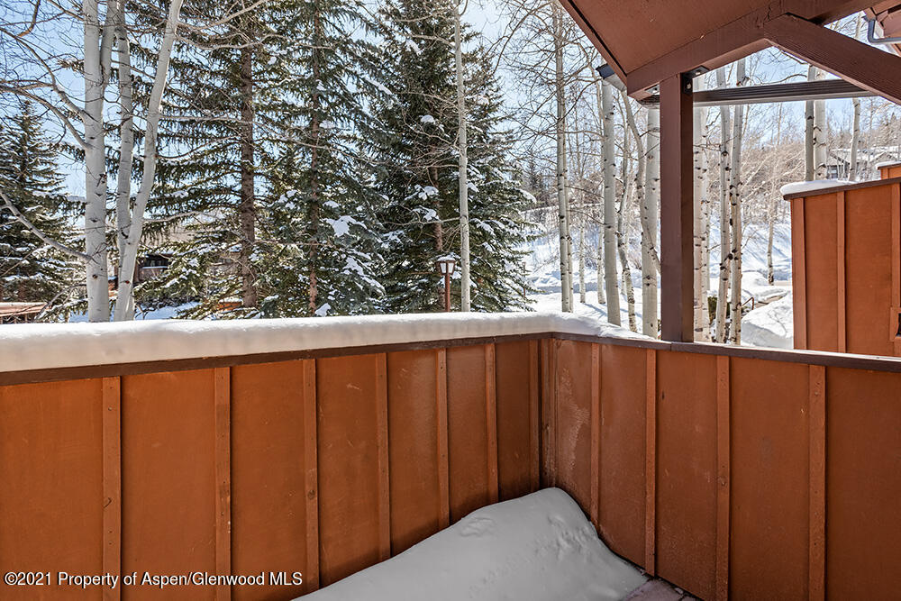 800 Ridge Road, Unit 12 Snowmass Village, CO 81615 - Photo 20 of 27 a view of balcony with wooden floor