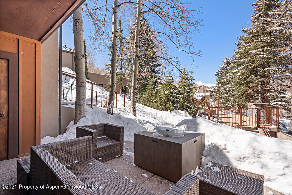 800 Ridge Road, Unit 12 Snowmass Village, CO 81615 - Photo 21 of 27 a outdoor space with barbeque area