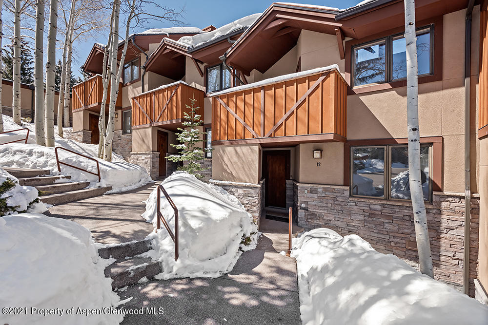 800 Ridge Road, Unit 12 Snowmass Village, CO 81615 - Photo 23 of 27 a view of a house with a patio