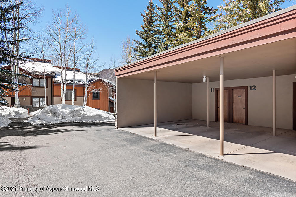 800 Ridge Road, Unit 12 Snowmass Village, CO 81615 - Photo 25 of 27 a view of a house with a garage