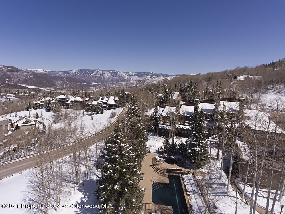 800 Ridge Road, Unit 12 Snowmass Village, CO 81615 - Photo 26 of 27 a view of a city with mountains in the background
