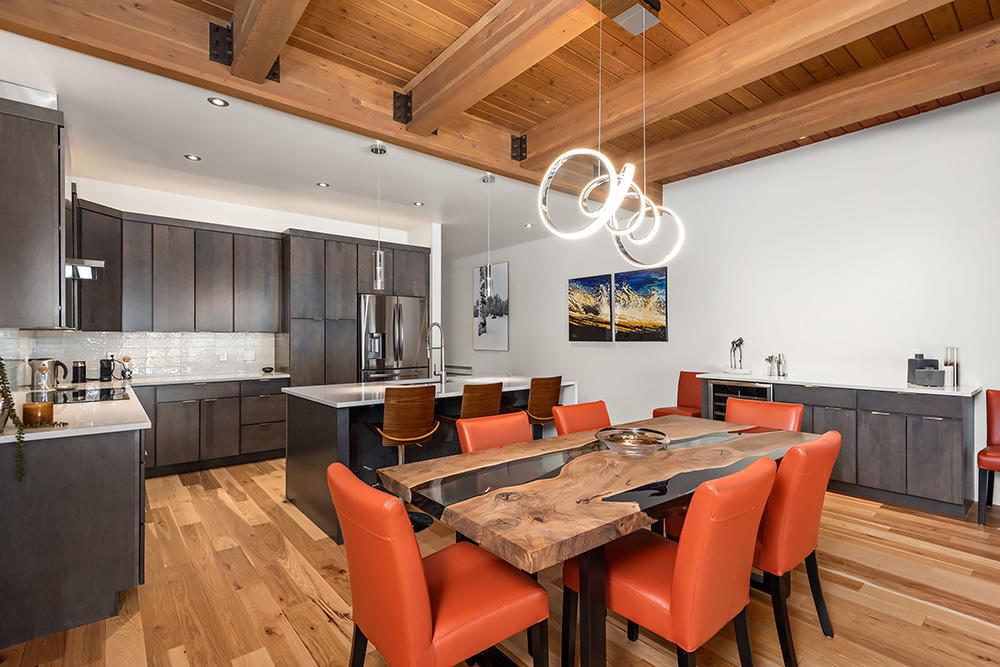 800 Ridge Road, Unit 12 Snowmass Village, CO 81615 - Photo 5 of 27 a dining room with wooden floor a sink table and chairs
