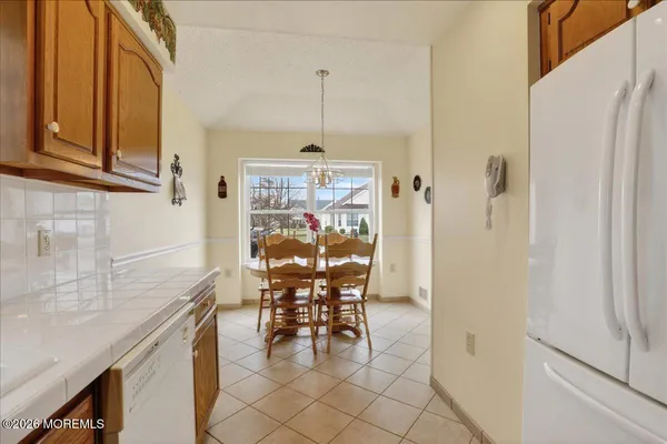 a dining room with furniture and a chandelier