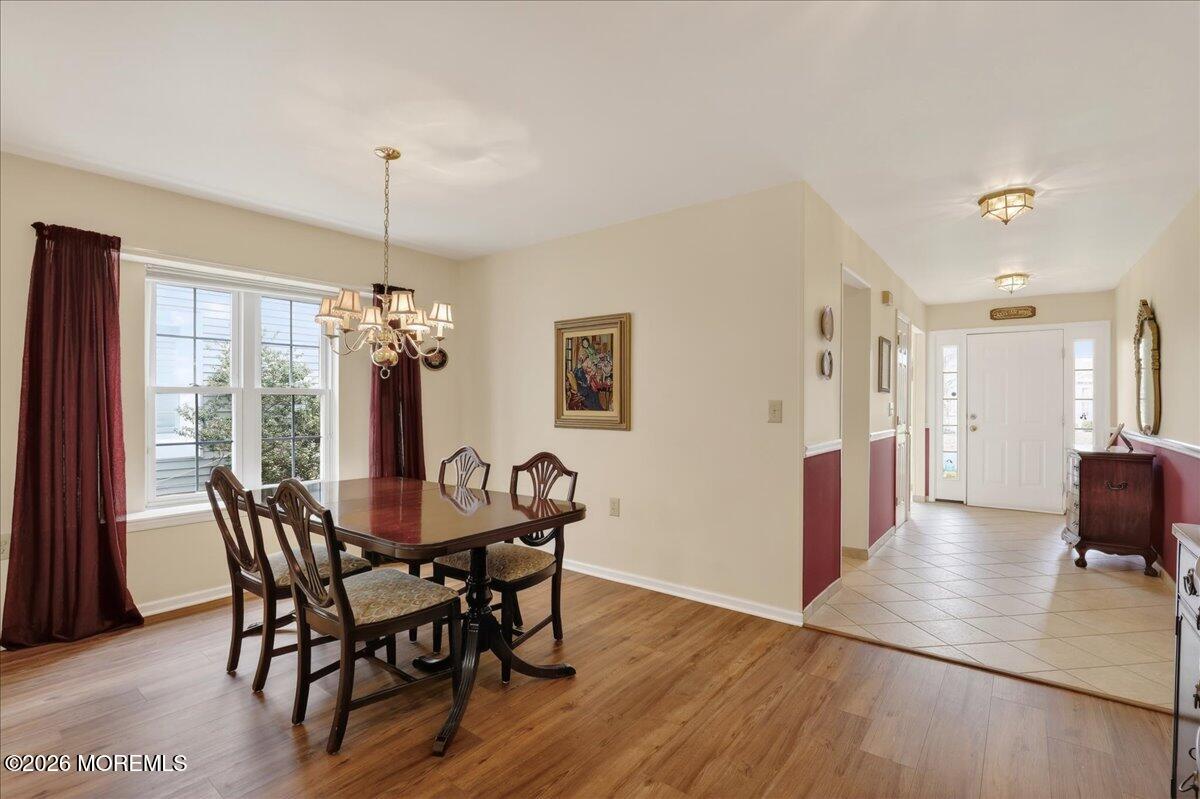 18 Angus Court Jackson, NJ 08527 - Photo 14 of 45 a view of a dining room with furniture window and wooden floor
