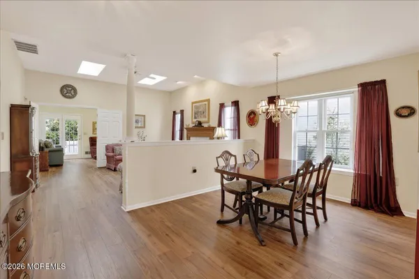a view of a dining room with furniture window and wooden floor