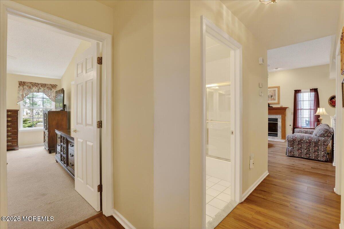 18 Angus Court Jackson, NJ 08527 - Photo 19 of 45 a view of a hallway with furniture and wooden floor