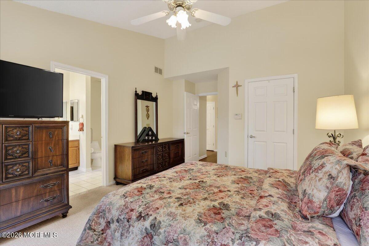 18 Angus Court Jackson, NJ 08527 - Photo 22 of 45 a bedroom with a bed and a flat screen tv