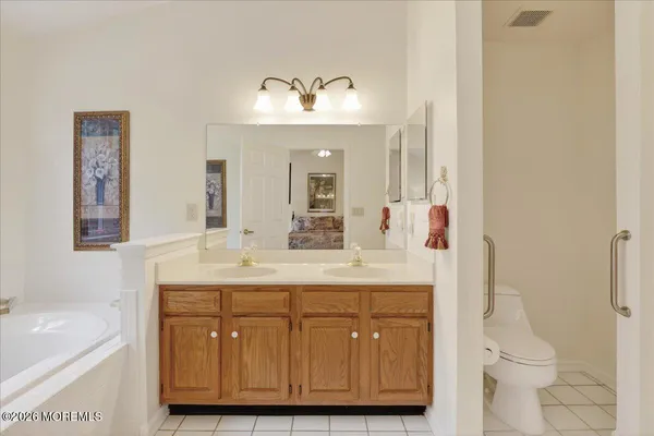 a bathroom with a sink a toilet and a bathtub