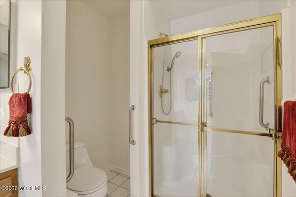 a bathroom with a shower and toilet