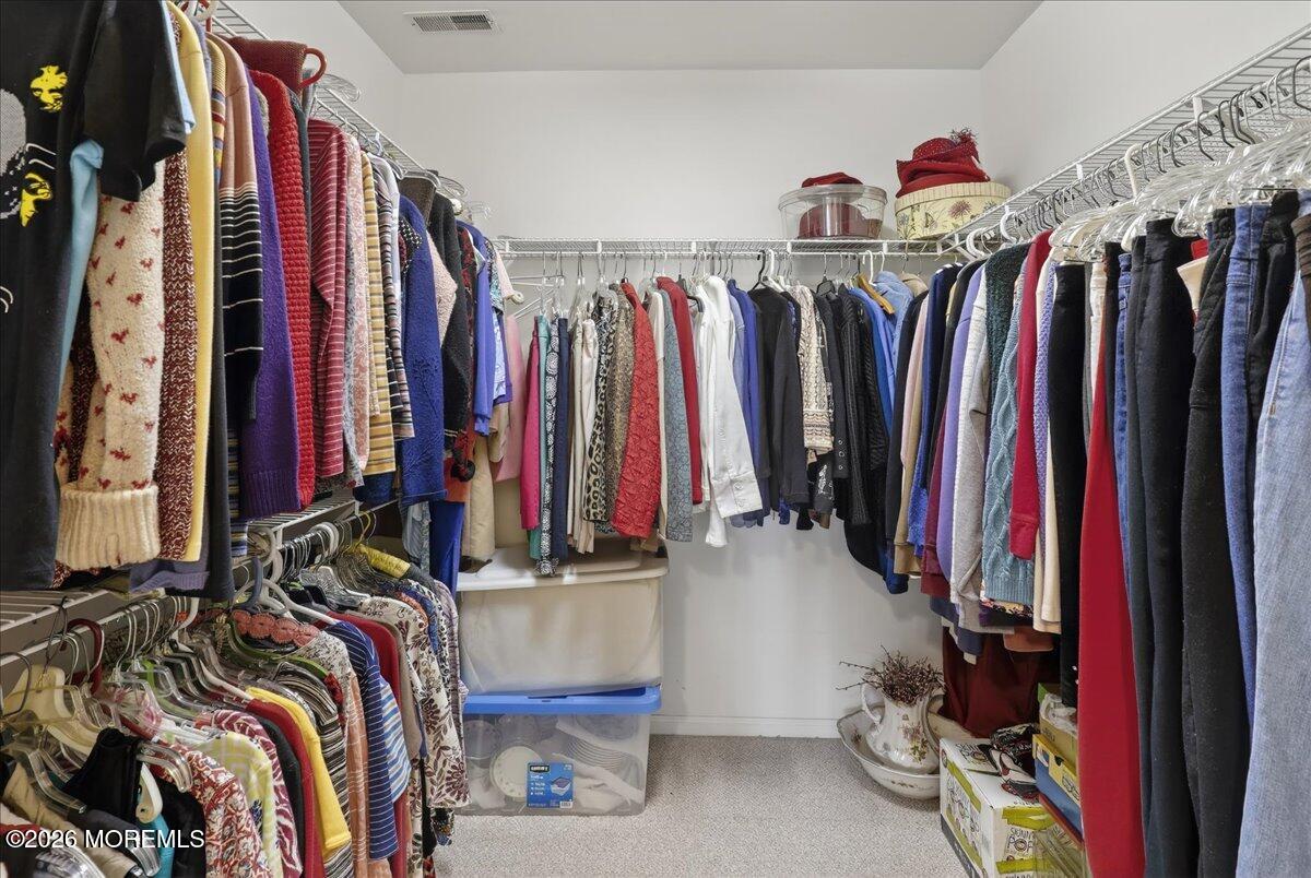 18 Angus Court Jackson, NJ 08527 - Photo 26 of 45 a view of walk in closet with clothes