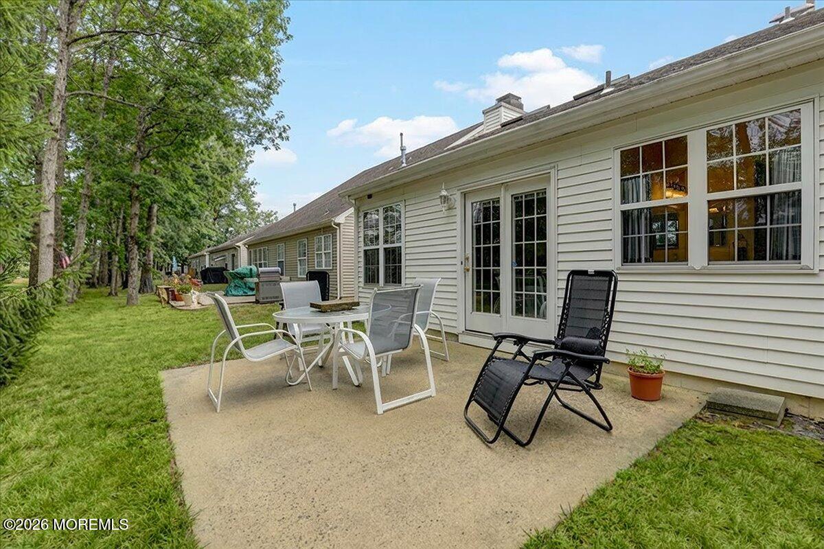 18 Angus Court Jackson, NJ 08527 - Photo 30 of 45 a view of a backyard with a patio and a garden