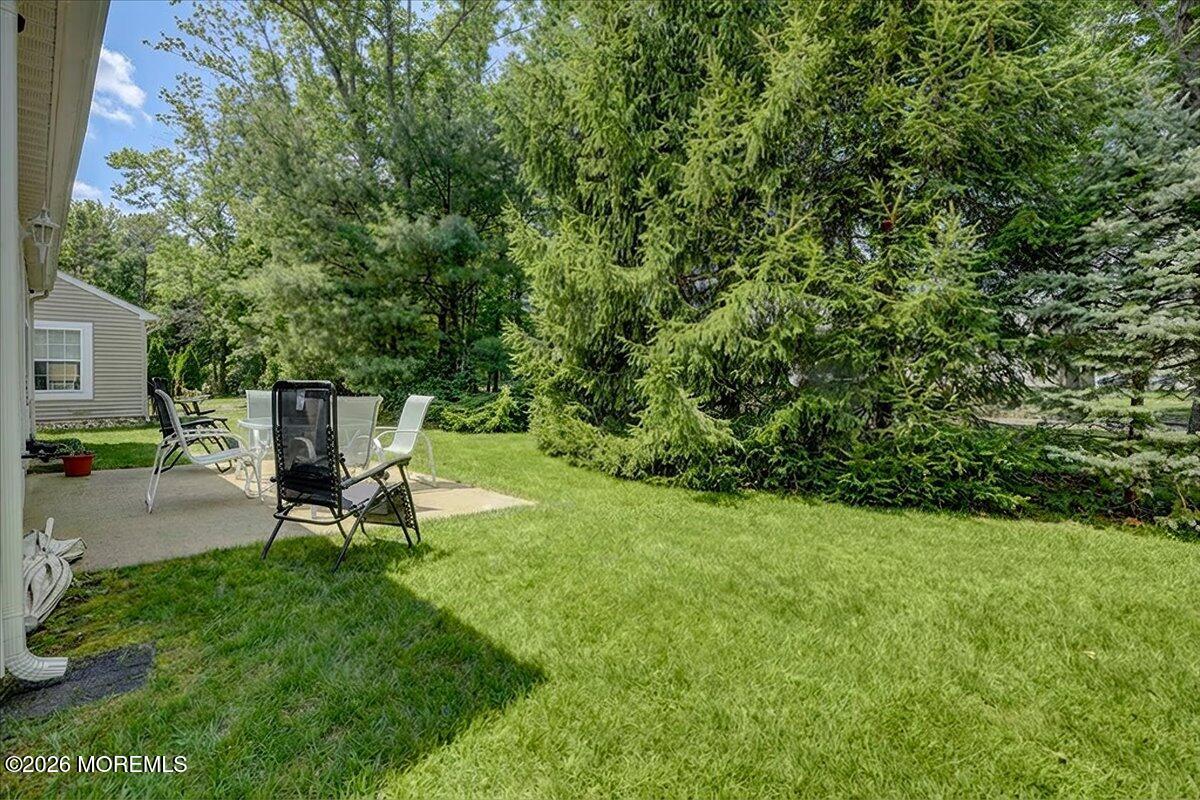 18 Angus Court Jackson, NJ 08527 - Photo 31 of 45 a view of a backyard with sitting area