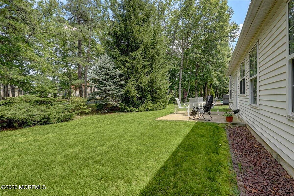 18 Angus Court Jackson, NJ 08527 - Photo 32 of 45 a view of a backyard with sitting area