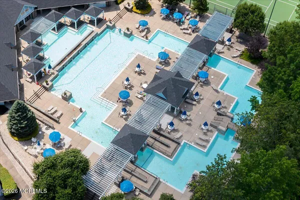 an aerial view of a house with a swimming pool