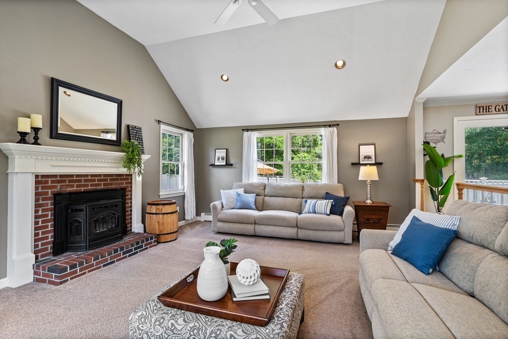 24 Devincent Drive Stow, MA 01775 - Photo 11 of 39 a living room with furniture and a fireplace